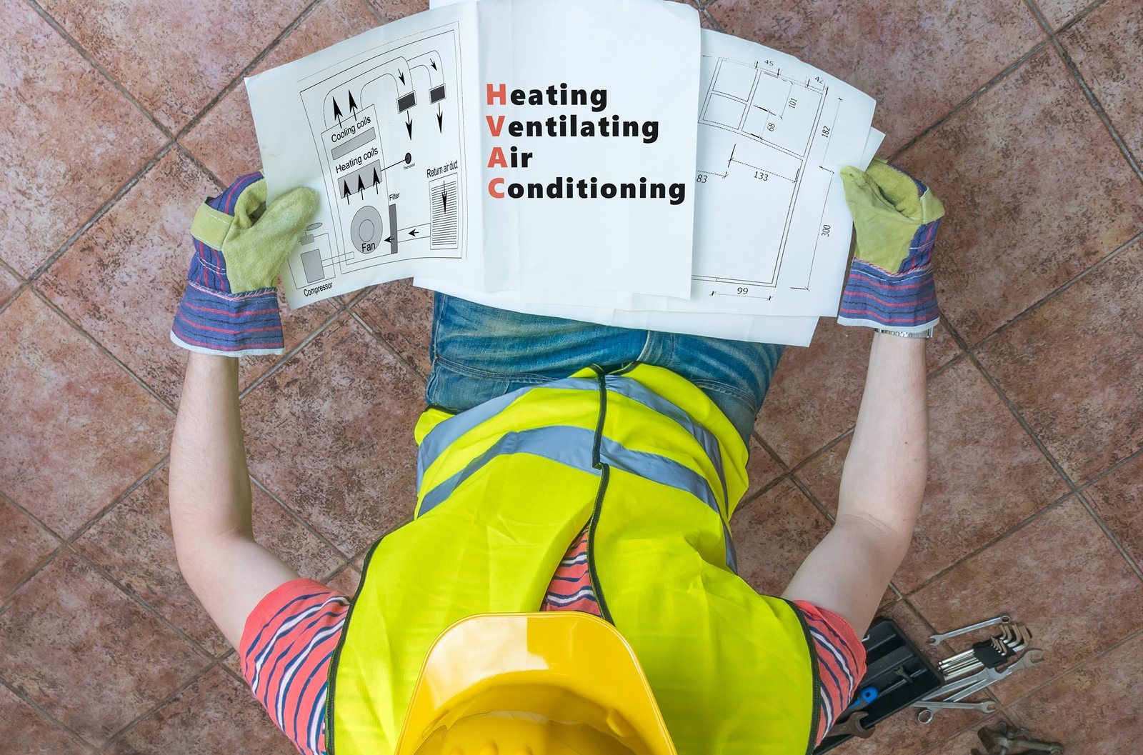 Plumber Is Looking At Documentation Of Hvac (heating, Ventilatin