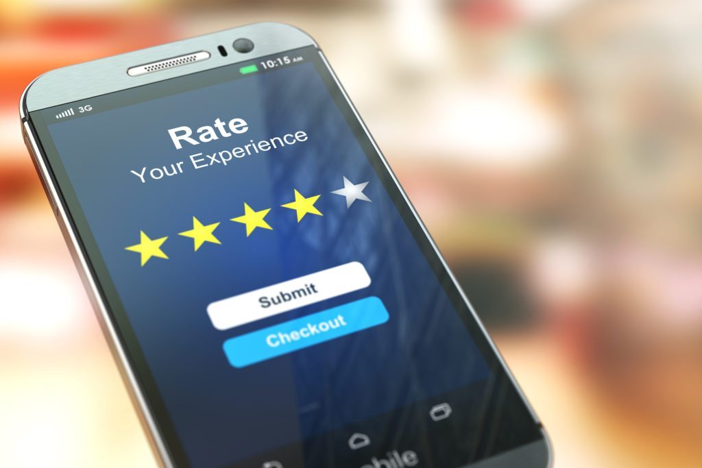 Smartphone or mobile phone with text rate your experience on the screen. Online feedback rating and review concept. 3d illustration